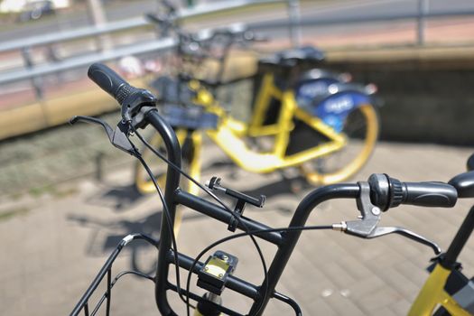 Rent bikes using code, city station with vehicle, take for street ride