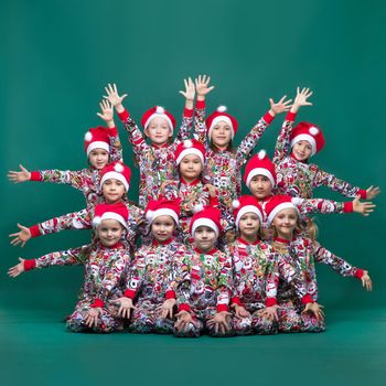 Group of kids posing with their hands outstretched