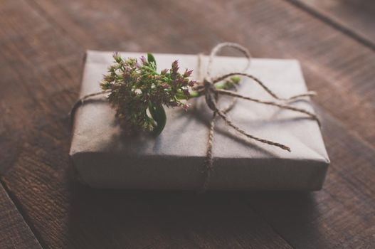 gift wrapped in wrapping kraft paper with a flower