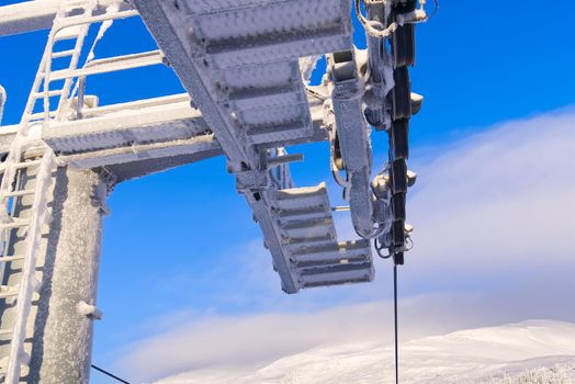 frozen funicular support poles. ski lift technology, ski resort, mountain resort.