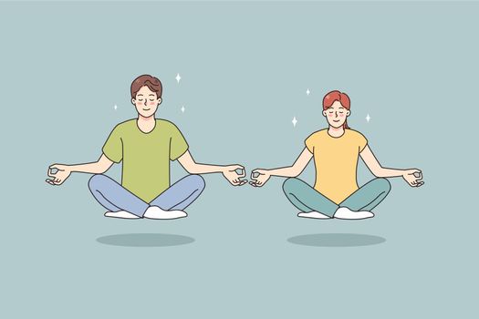 Calm man and woman meditate in lotus position