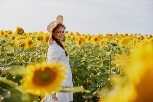 woman with two pigtails in a field of sunflowers lifestyle countryside. High quality photo