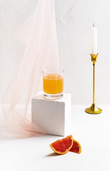 Grapefruit juice on a white background
