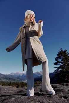 Stylish woman fashion glasses mountain top nature freedom lifestyle