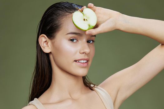 beautiful woman green apple near face health Green background