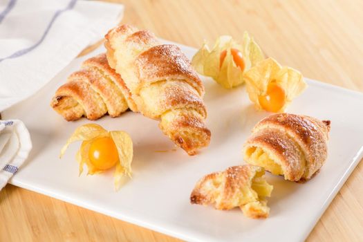 Small croissant with physalis fruits
