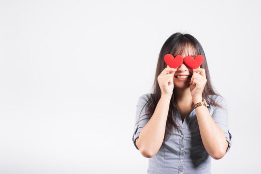 Woman standing her smile confidence cheerful cheery girl holding in hands two red heart symbol cards closing eyes