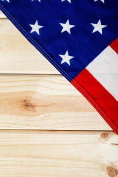 Overhead view of usa flag with stars and stripes on wooden table