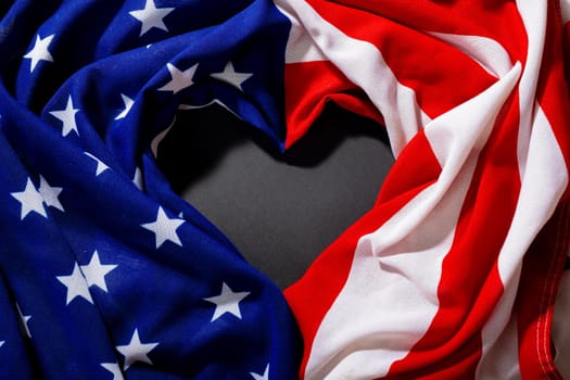 Overhead view of crumpled america flag with stars and stripes making heart shape