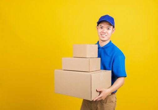 happy man logistic standing he smile wearing blue t-shirt and cap uniform holding parcel box