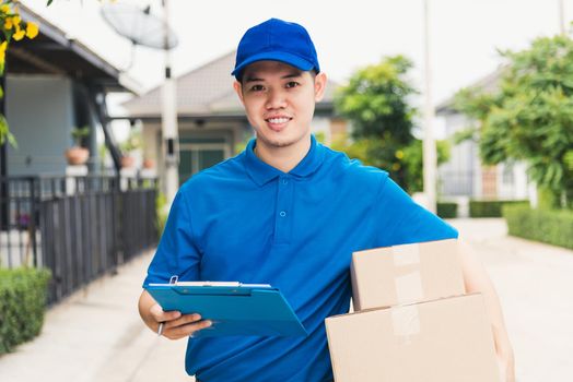 delivery man courier in uniform hold parcel post boxes service shipment and walking finding and looking for customer home