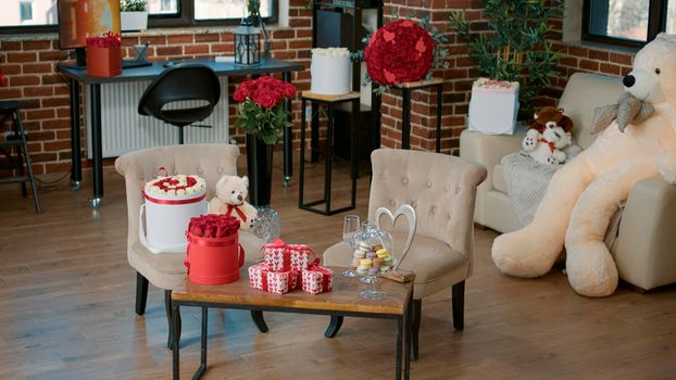 Empty room with surprise valentine day luxury gifts, red roses bouquet and giant teddy bear