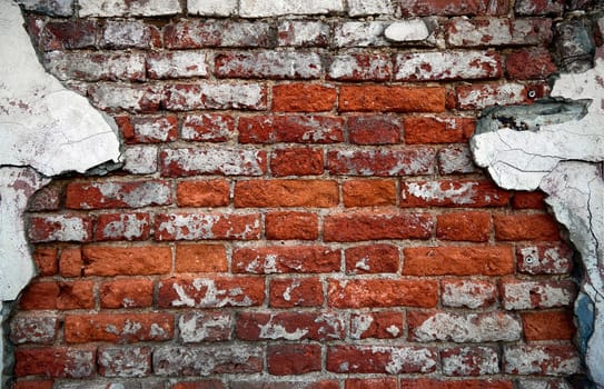 Old Red Brick Wall with plaster remnants, Brick wall background texture
