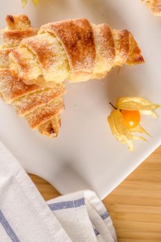 Small croissant with physalis fruits