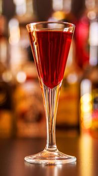 refreshing liqueur in a tall glass, alcoholic drink prepared by the bartender