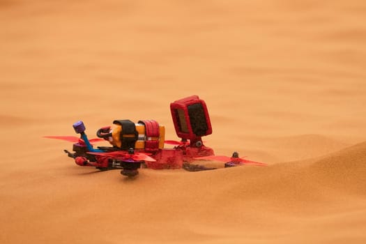 Sports quadcopter on the sand in the desert