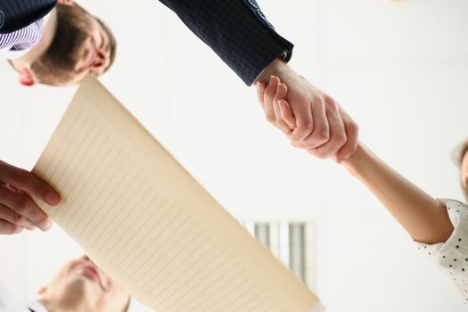 Partners shake hands over business agreement, successful deal between biz partners