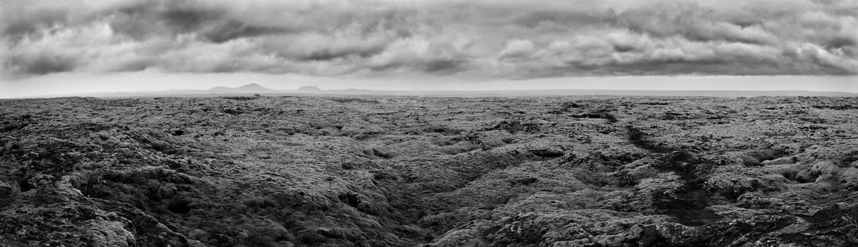 Beautiful panorama of the amazing volcanic mossy landscape. Lava fields in Iceland. Panorama of Iceland