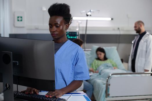 African american nurse using personal computer for clinical imaging