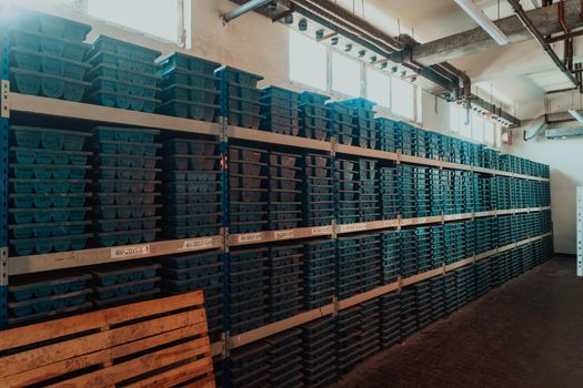 Gold mining storage rock core samples geology drilling industy. Large ore warehouse in modern industry, ores stacked in boxes. Selective focus