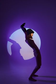 glamorous woman posing on stage spotlight silhouette disco color background unaltered