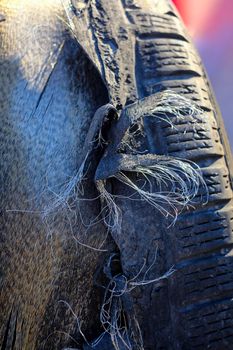 Drift car tires destroyed after sports session with steel wire belted in evidence. High quality photo