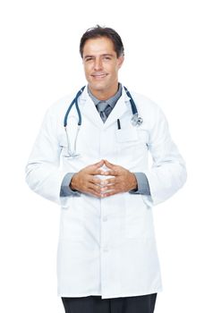 Confident middle aged doctor standing isolated on white. Portrait of a confident middle aged doctor standing isolated on white background.