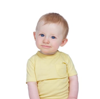 Curious kid. Studio shot of a cute baby boy in a yellow shirt.
