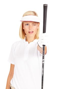 Checking for that perfect balance. Studio shot of an attractive young golfer using her club to aim isolated on white.