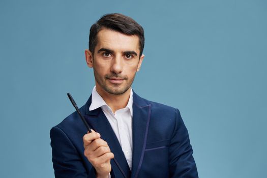 businessman portrait pen in hand manager's workflow blue background