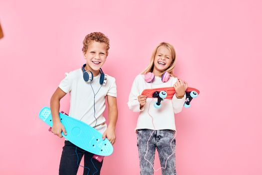 Children riding skateboard are playing together isolated background