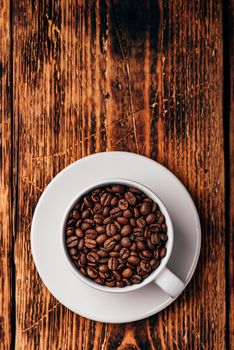 Roasted coffee beans in white cup