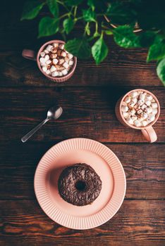 Stack of Chocolate Donuts and Hot Chocolate with Marshmallow