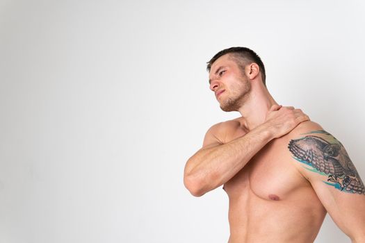 The muscles of the neck in a man on a white background are hurt ache hurt muscle, cramp spine caucasian massage illness expression. Tension therapy, lower suffer attractive