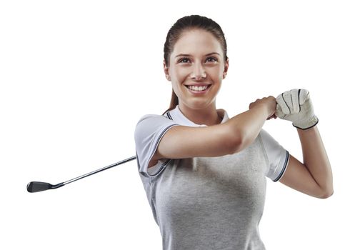 Handling her club with confidence. Studio shot of a young golfer practicing her swing isolated on white.