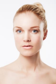 Portrait of a beautiful blonde against a white background.