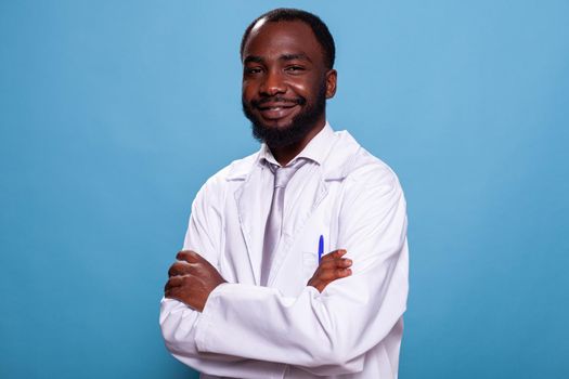 Portrait of smiling african american doctor posing with arms crossed