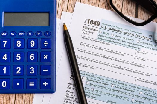 Tax forms 1040. U.S Individual Income Tax Return on a desk. Tax concept