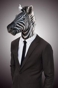 Earn your stripes in the corporate jungle. Studio portrait of a businessperson with a zebra head.