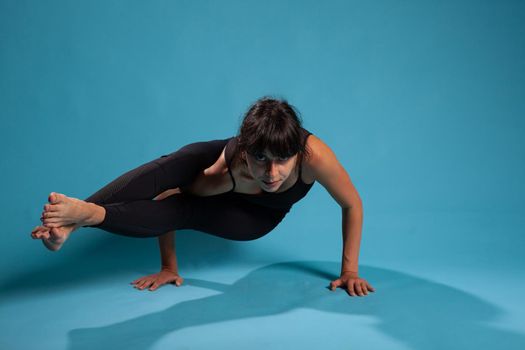 Portrait of fit person standing in hand training arm balance