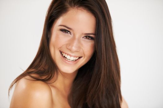 Beauty is power a smile is its sword. Cropped shot of a beautiful brunette.
