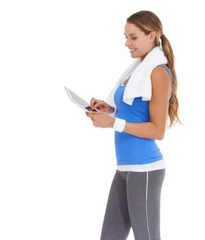 My status is now Fit and feeling great. Young woman in sportswear using a tablet while isolated on white.