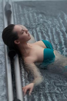 Sensual female in hot pool