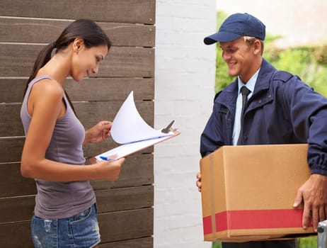 Making sure that the documentation is in order. Cropped shot of a beautiful woman receiving a delivery.
