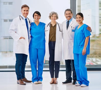 Were the team you need. Portrait of a medical team standing in a hospital.