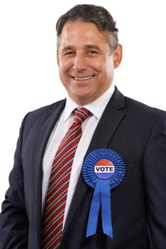 Im the right man for the job. Portrait of a man in a suit with a voting ribbon on a white background.