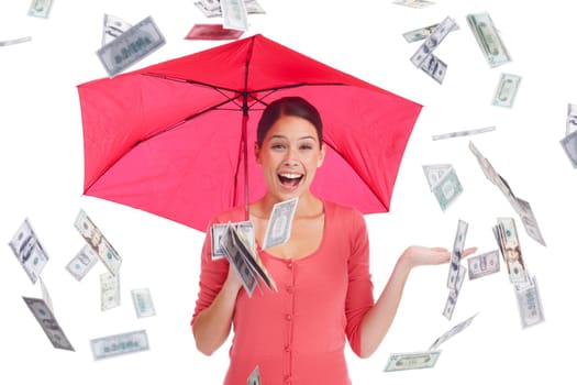 What we all want. Pretty young woman under a red umbrella with money showering down.