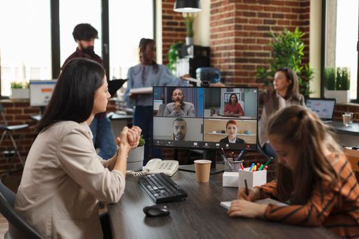 Woman in business video call conference meeting communicating to company colleagues