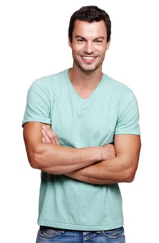Cool and casual. A handsome young man crossing his arms while isolated on a white background.