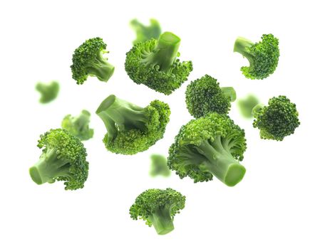 Green broccoli levitating on a white background
